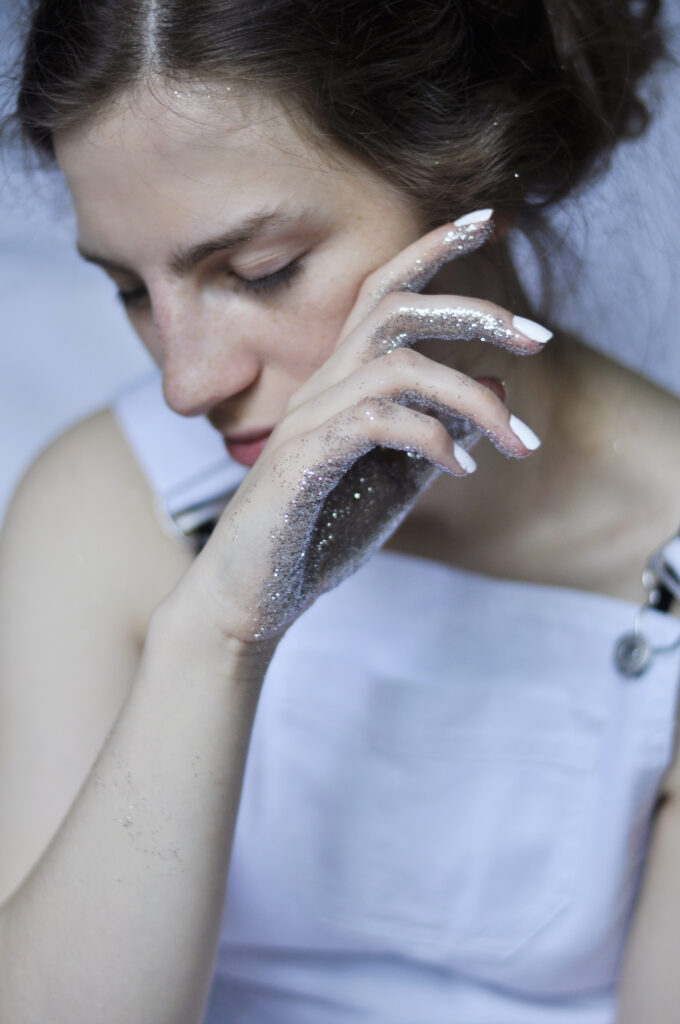woman with glitter on hands