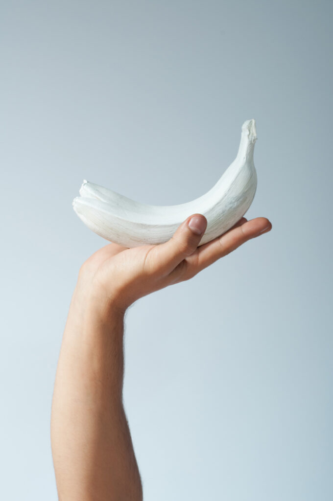white banana in a hand