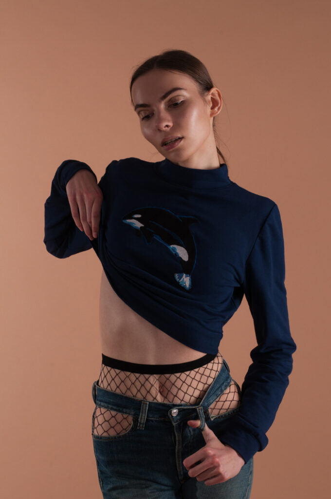 woman wearing sweatshirt and fishnet tights