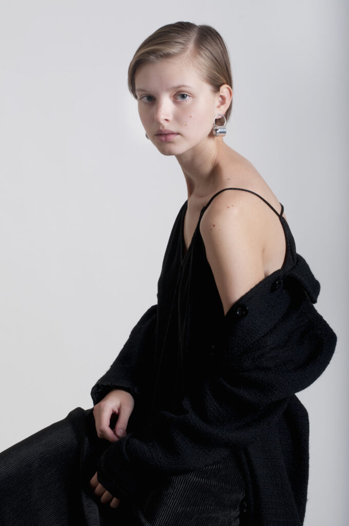 short-hair woman in black outfit