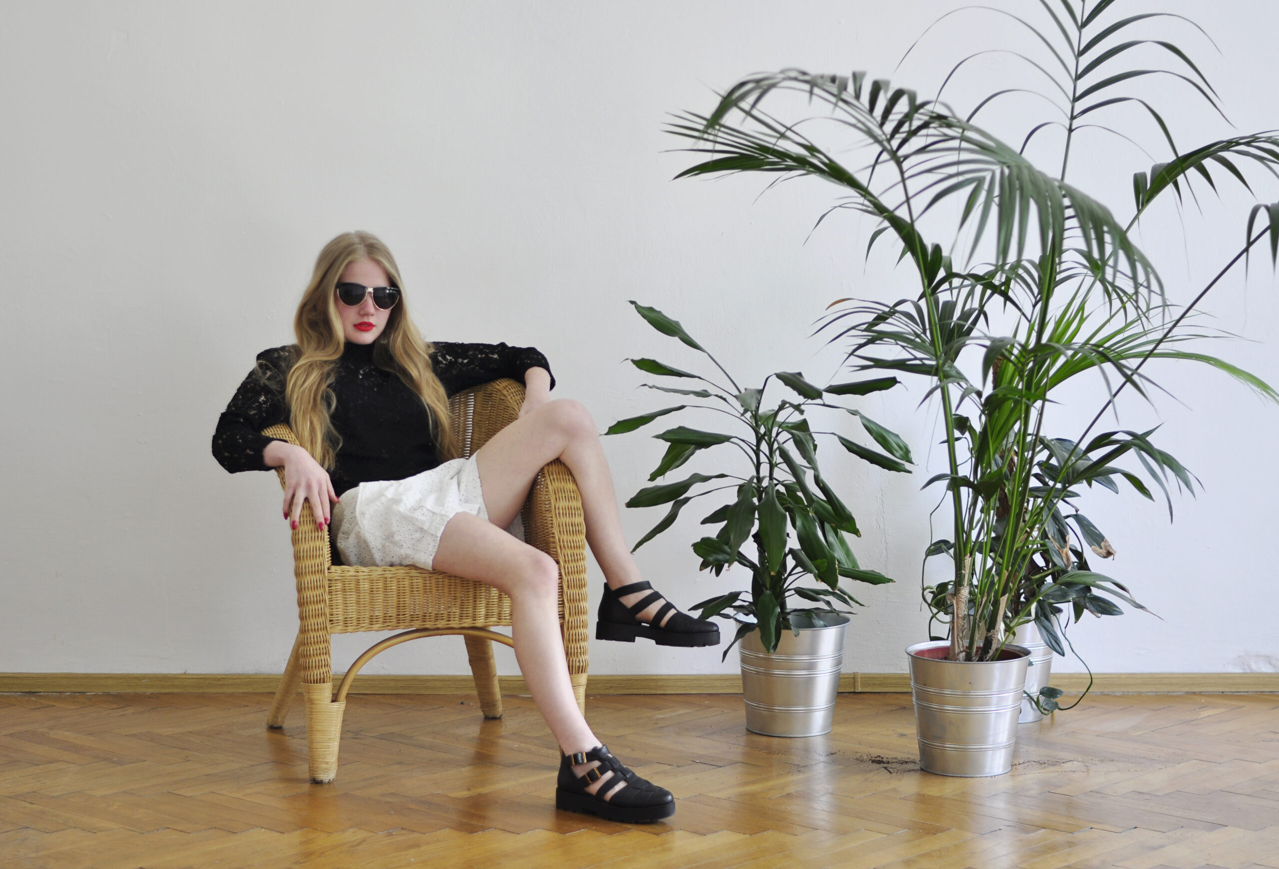 girl next to houseplants