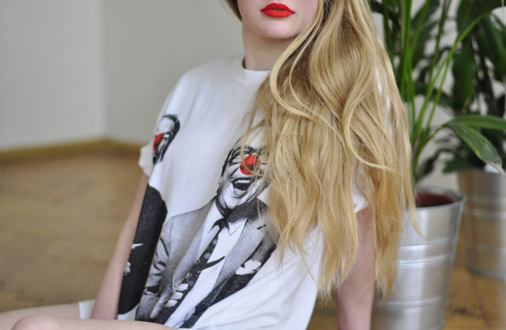 girl with red lips in graphic T-shirt